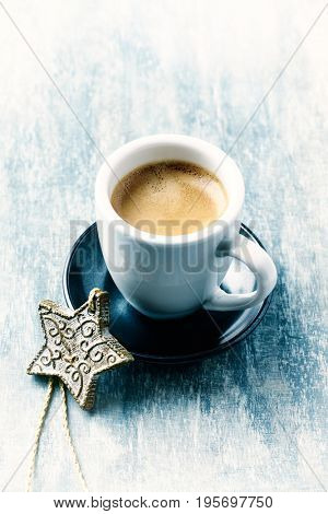 Cup of Coffee and a Christmas decoration