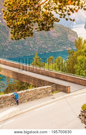 Tourist Woman On Stegastein Viewpoint Norway