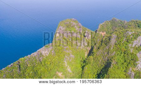 Aerial drone view of tropical turquoise surrounded by limestone cliffs, Phi Phi islands, Thailand