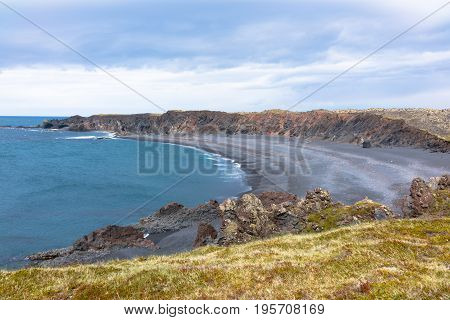 Djupalonssandur is a beautiful pebbled beach with a series of rocks of mysterious form emerging from the ocean
