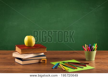 Back to school concepty with clear blackboard background, desk, items