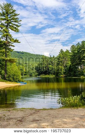 Scenic mountain pond where you can kayak and swim in New Hampshire