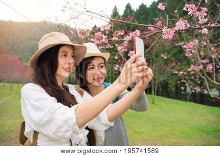 Girlfriends Looking At View Taking Snapshots
