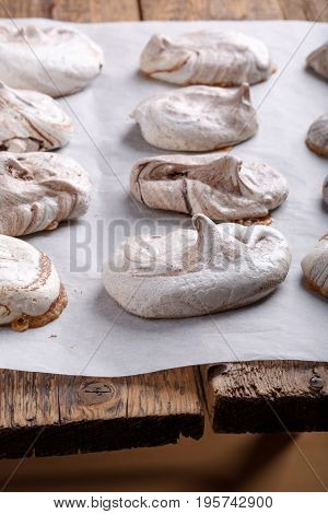 Homemade marble chocolate meringue cookies on a baking sheet