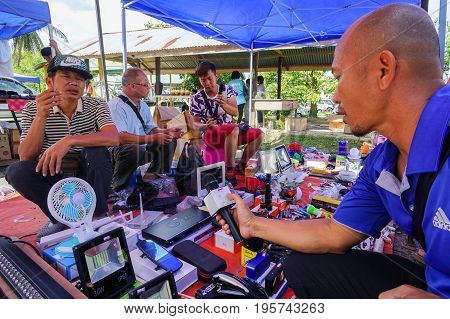 Keningau,Sabah,Malaysia-June 29,2017:Local people buying various electronic street shop at the local market Tamu in Keningau,Sabah.In Tamu there are many cheaper Chinese electronic gadget for sale.