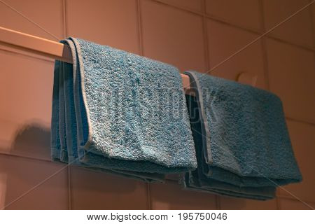 underexposed of the blue towel on the bathroom hanger