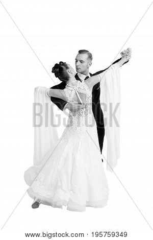 dance ballroom couple in a dance pose isolated on white background. sensual professional dancers dancing walz tango slowfox and quickstep. Black and white