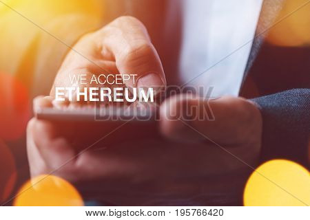 We accept Ethereum cryptocurrency concept with businessman