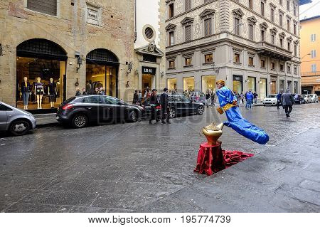 FLORENCE, ITALY - MARCH 27: Street performer dressing as Genie and the Magic Lamp on a street in Florence, Italy on March 27, 2015