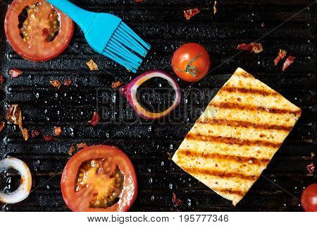 ofu on the grill on the table on a black background, view from the top