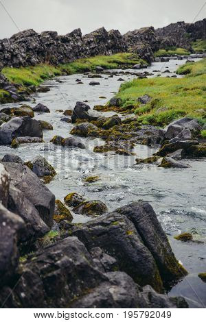 Waterfall at Pingvellir, the continental divide in Iceland between The Eurasian Continent and The North American Continent.Beautiful Oxararfoss waterfall, Thingvellir National Park, Iceland.