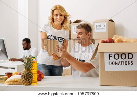 We missed something. Dedicated capable nice lady checking the contents of the box and finding a mistake in the list of items while working pro bono