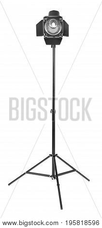 Studio flash with barn door, isolated on a white background. Photo-studio with lighting equipment. Studio lighting on a tripod stand. Spot light photography equipment.