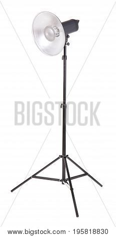 Professional studio flashlight, isolated on a white background. Photographic studio light with a tripod. A reflector, an outbreak on a tripod. Photo equipment.