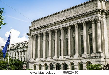 Department of Agricolture Washington DC US, Colonnade with American flag flying US , The building is located near the National Mall in Washington DC.