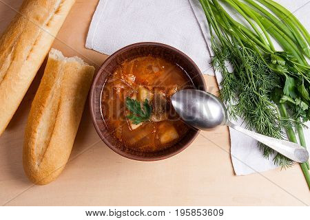 Borsch - Traditional Ukrainian And Russian Red Beetroot Soup With Red Beets In Clay Bowl With Metal