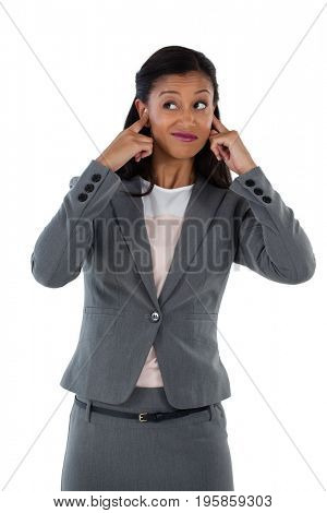 Irritated businesswoman covering her ears. Hear no evil concept