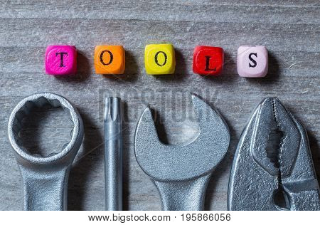 Letter Cube And Tool On Gray Wood Visualization