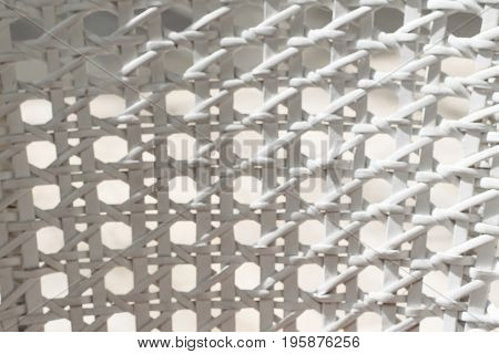 White wicker backrest. Close up texture. Chair.