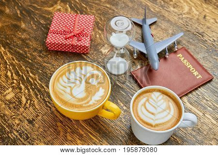 Coffee, present and hourglass. Passport and toy plane. How to get visa faster.