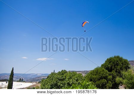 Paraglider flying from the Pamukkale park.Turkey.July 2017