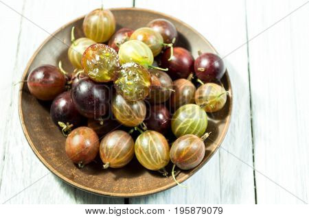 Gooseberry In An Earthenware Plate.