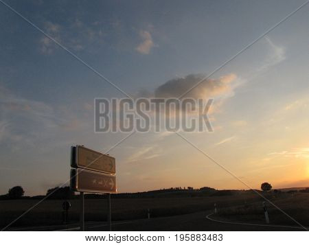 A road in nature at sunset with clear sky It is a wonderful weather