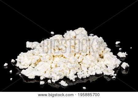 Pile of delicious homemade cottage cheese on a black background