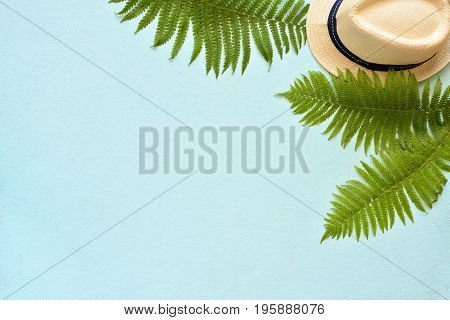 Summer Vacation, Resort Theme. White Bucket Hat With On Blue Background With Green Palm Leaves. Flat