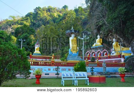 Park with lots of Buddha statues near sacred Kaw Ka Thawng Cave in Hpa-An Myanmar