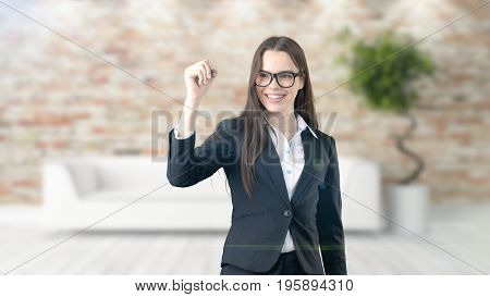 Young Beautiful Business Woman And Creative Designer Standing Over Blured Interior Background