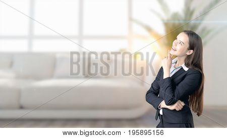 Young Beautiful Business Woman And Creative Designer Standing Over Blured Interior Background