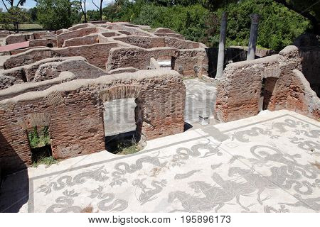 OSTIA ANTICA ITALY - JULY 2 2017: lavacrum ostiense an ancient Roman Mosaic Floor in the Neptune Baths