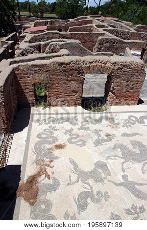 OSTIA ANTICA ITALY - JULY 2 2017: lavacrum ostiense an ancient Roman Mosaic Floor in the Neptune Baths