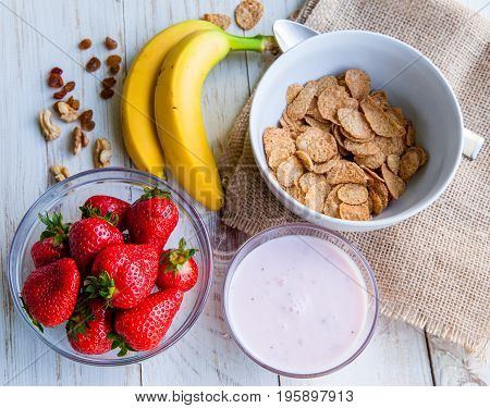 Healthy Breakfast which included cornflakes and oatflakes, yogurt, bananas and strawberries