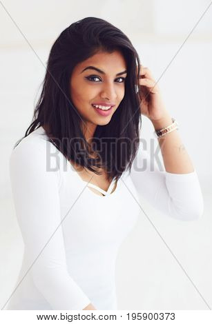 portrait of beautiful young indian woman on white