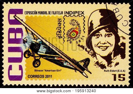 Moscow Russia - July 18 2017: A stamp printed in Cuba shows American pilot Ruth Elder and her airplane Stinson 'American Girl' series 