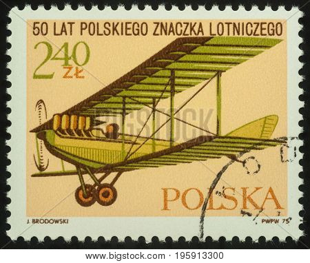 Moscow Russia - July 17 2017: A stamp printed in Poland shows flying old aircraft series "The 50th Anniversary of Polish Airmail Stamps" circa 1975