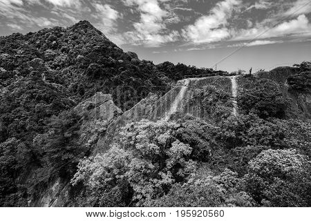Bold black and white mountain jungle landscape of a rocky ridge on the Wu Liao Jian hiking trail in Taiwan