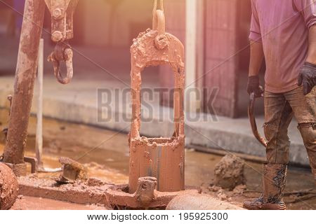Worker Installing Wet-process Bored Pile For Outside Public Construction