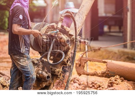 Worker Installing Wet-process Bored Pile For Outside Public Construction