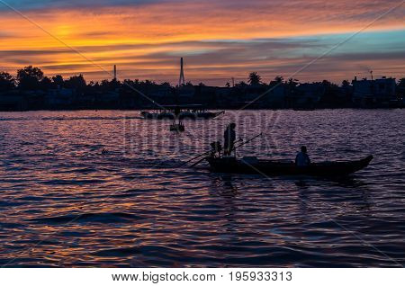 Can Tho, Vietnam - August 12, 2015: Traditional boats on the Can Tho River in Can Tho, Vietnam at sunrise.