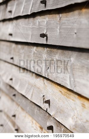 Textures patterns and backgrounds concept. Light old wooden wall detail board closeup