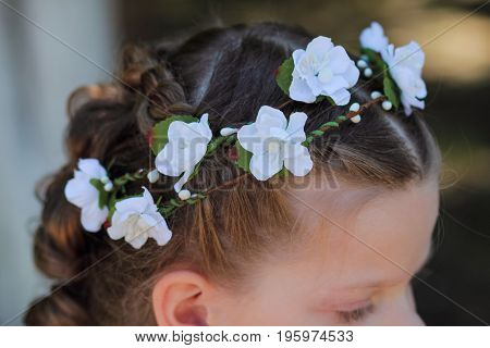 Wreath of artificial flowers in the hair of a little girl accessories for hair - wreaths