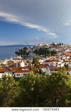 View of the old harbour on Skiathos island and Euboea in the distance, Greece.