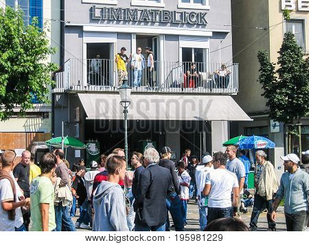 Zurich, Switzerland - August 11, 2007: Techno Street Parade With Crowd Of Many People And Limmatblic