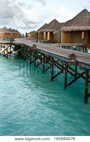 Water villas in the Maldives. Blue sky and turquoise water