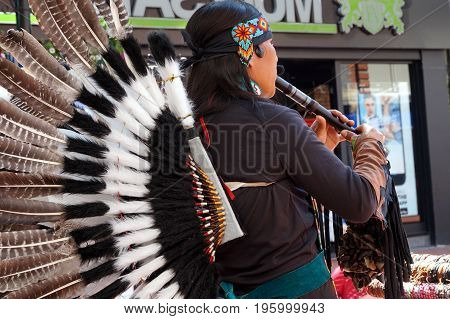 Reading, Uk - June 17Th 2017:native South American Flute Player In Traditional Costume With Feathers