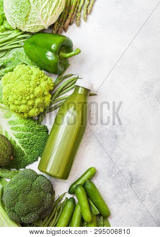 Assorted Green Toned Raw Organic Vegetables On White Stone Background. Avocado, Cabbage, Cauliflower