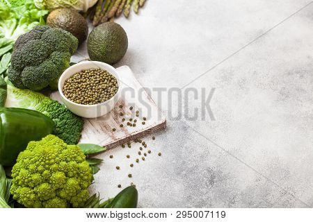 Assorted Green Toned Raw Organic Vegetables On White Background. Avocado, Cabbage, Broccoli, Caulifl